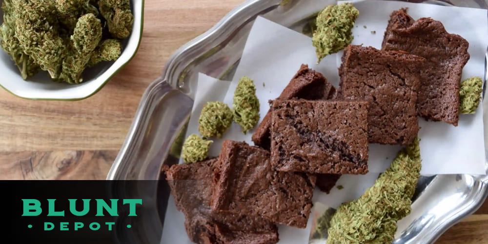 A plate of freshly baked cannabis brownies cut into squares, ready to serve.