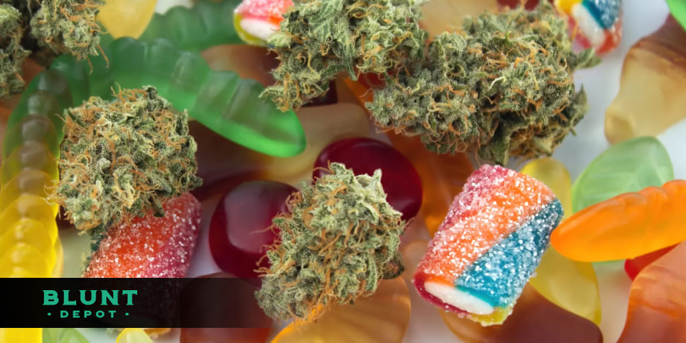 Simple arrangement of colorful THCA gummies and fresh cannabis leaves on a neutral background