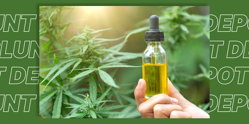 A bottle of CBD oil with fresh hemp leaves, symbolizing natural cortisol regulation.