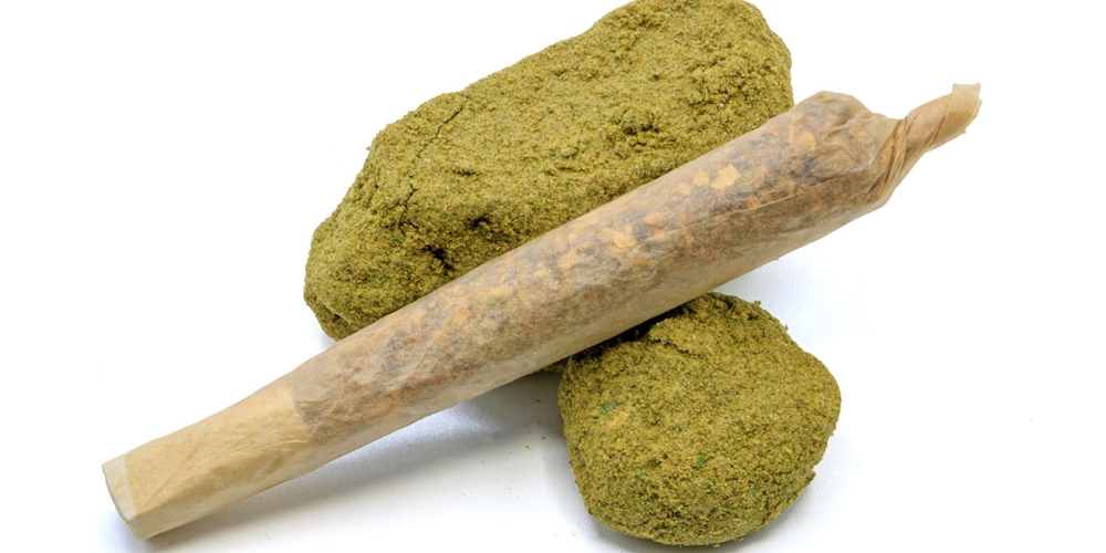 Strawberry Diesel THCA infused joint on a glass surface