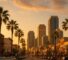 AI Generated Image: Hyper-realistic golden hour street-level view of a generic San Diego city streetscape with clean storefronts, low-rise buildings, neutral street furniture, and distant hills, no people or signage.