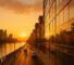 AI Generated Image: Golden hour street-level view of a Riverside city streetscape with clean storefront glass reflections, low-rise buildings, distant hills, and warm cinematic lighting
